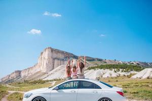 Happy family of three in the mountains photo