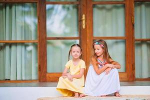 Adorable little girls on summer exotic vacation photo