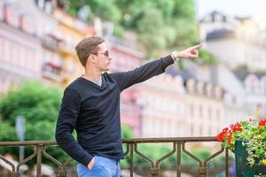 Man tourist outdoors in italian village on vacation photo