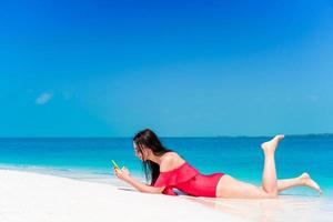 Beautiful woman during tropical beach vacation photo
