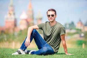 Happy young urban man in european city. photo