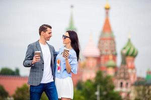 Young dating couple in love walking in city background St Basils Church photo