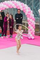 Little gymnast training on the carpet and ready for competitions photo