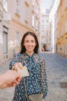 Closeup shot of a woman passing a payment credit card. photo