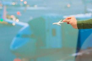 Close up hand holding an airplane model photo