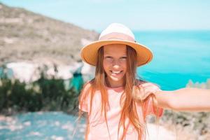 Little girl on vacation travel background beautiful landscape photo