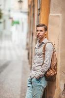 Carefree young man searching for place of destination photo