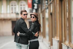 Europe travel tourists couple walking in old streets of the city photo