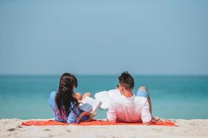 Young couple on white beach during summer vacation. photo