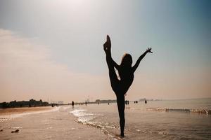 beautiful girl having fun on tropical seashore photo