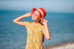 beautiful girl having fun on tropical seashore. photo