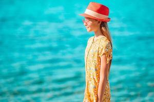 beautiful girl having fun on tropical seashore. photo