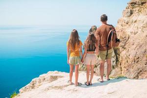 Happy beautiful family on a tropical beach vacation photo