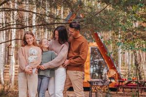 Beautiful family walking at autumn warm day photo