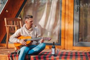 Happy man on the terrace in autumn photo