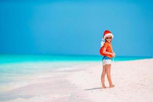 Kid on the beach in Christmas vacation photo