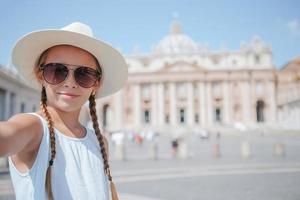Happy kid at St. Peter's Basilica church in Vatican city. photo