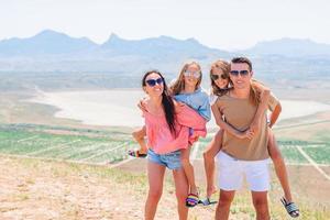 Happy family on vacation in the mountains photo