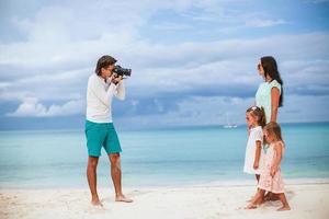 Man taking a photo of his family