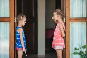 Dental hygiene. Adorable little smile girls brushing her teeth photo