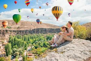 Happy couple on summer vacation in famous place. Cave formations. photo