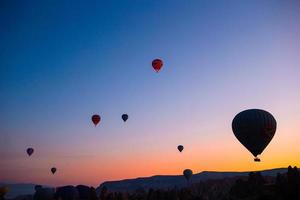 Bright hot air balloons in sky of Cappadocia, Turkey photo