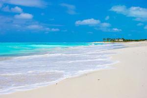 Perfect white beach with turquoise water on Caribbean island photo