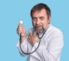 Mad doctor with a stethoscope photo