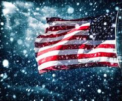 American flag against a cloudy sky with a rainbow photo