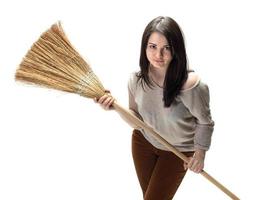 Young woman with a broom photo