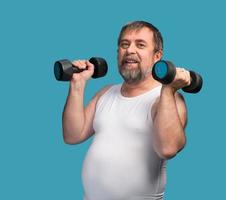 man exercising with dumbbells photo