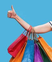 Happy young woman with shopping bags photo