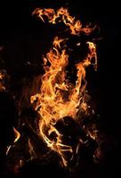 Fire flames on a black background photo