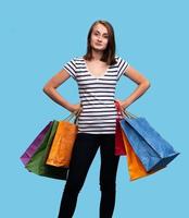 Happy young woman with shopping bags photo