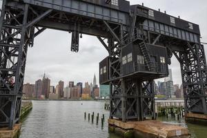 Abandoned gantry with city view behind. photo
