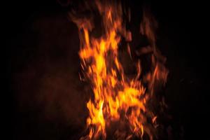 Fire flames on a black background photo