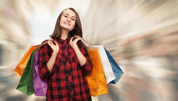 Young woman with shoping bags photo
