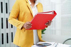 Business woman busy working with documents in office. photo