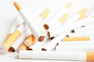 Cigarette isolated on white background with clipping path, roll tobacco in paper with filter tube, No smoking concept. photo