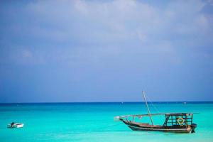Old wooden dhow at the sea in the Indian Ocean photo