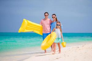 Young family enjoy beach vacation photo