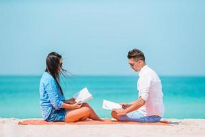 Young couple on white beach during summer vacation. photo