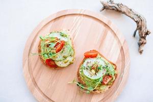 Tasty italian bruschetta on the wooden plate photo