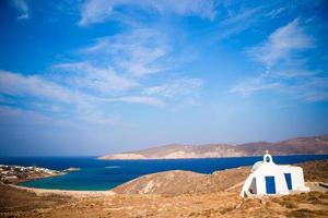 Traditional white church with sea view in Mykonos island,Greece photo