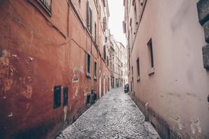 Old beautiful empty narrow streets in small city of Lucca in Italy photo