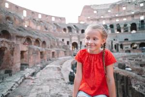 Little girl outdoors in Coliseum, Rome, Italy. photo