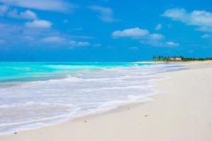 Perfect white beach with turquoise water on Caribbean island photo