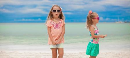 Two little girls during tropical beach photo