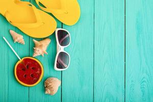 summer bavkground top view close up, summer accesories on wooden background photo