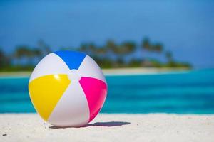 Air ball at white beach with turquoise sea and blue sky photo